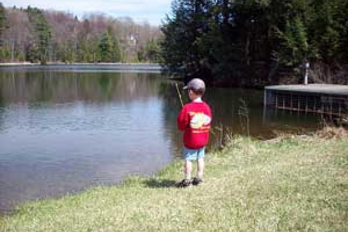 A young fisherman at Brewer Pond, photo by Melissa Noe